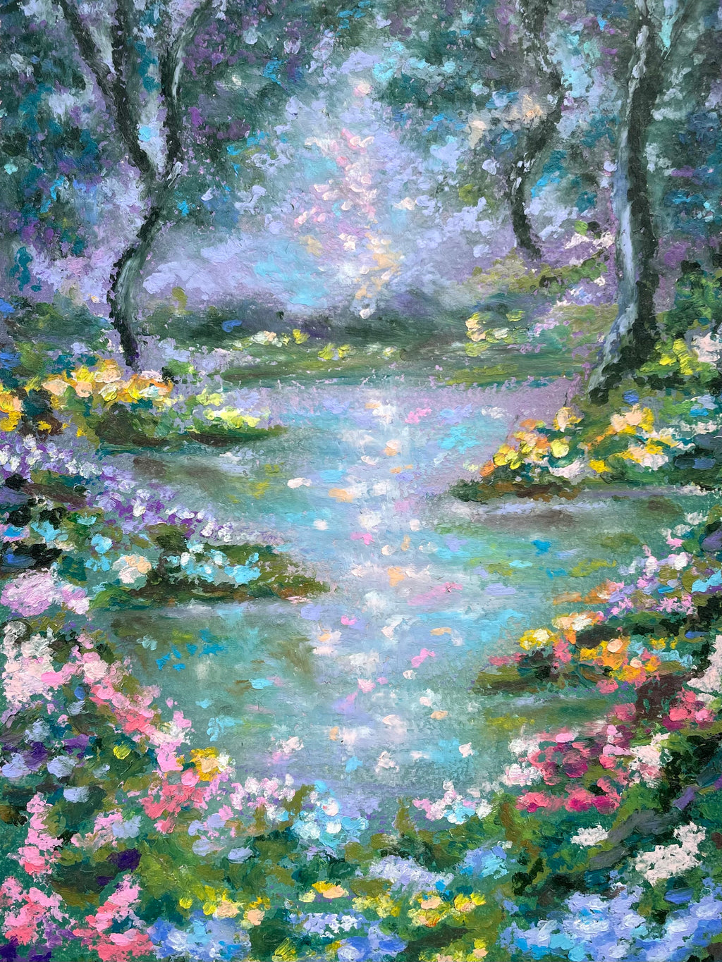 Impressionistic oil pastel painting of a serene river winding through a lush forest, framed by vibrant wildflowers in pink, yellow, purple, and blue. The scene features soft, painterly brushstrokes with dominant hues of green, blue, and purple.