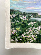 Close-up of an oil pastel painting on paper showing a landscape with green foliage, pink and white flowers, a small yellow butterfly, and a blue sky.
