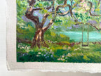 A close-up of an impressionistic landscape painting on textured paper, featuring a large gnarled tree with green foliage, a turquoise body of water, and a swing set in the background.