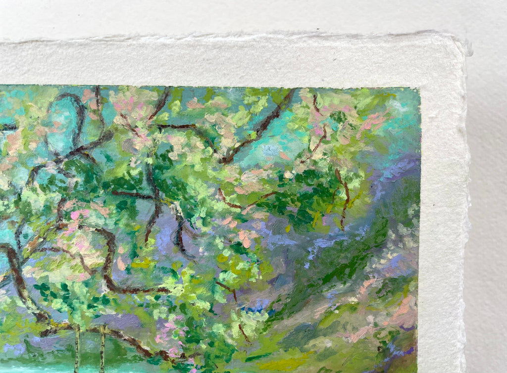 A close-up of a textured paper painting depicting a lush, impressionistic landscape with green and pink trees, painted in a vibrant teal and purple sky.