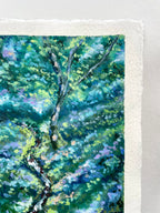 A close-up of a textured oil pastel painting depicting a lush green tree with blue and purple undertones.