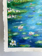Textured close-up of lily pads and delicate water lilies in an original oil pastel pond landscape painting with vibrant deep blue water, impressionist oil pastel texture and peaceful nature details.