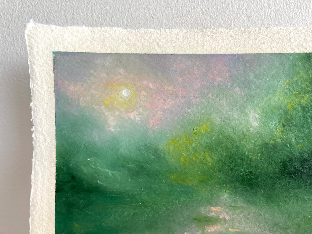 A close-up of a textured cream paper edge with a painted landscape scene showing soft green, pink, and yellow brushstrokes.