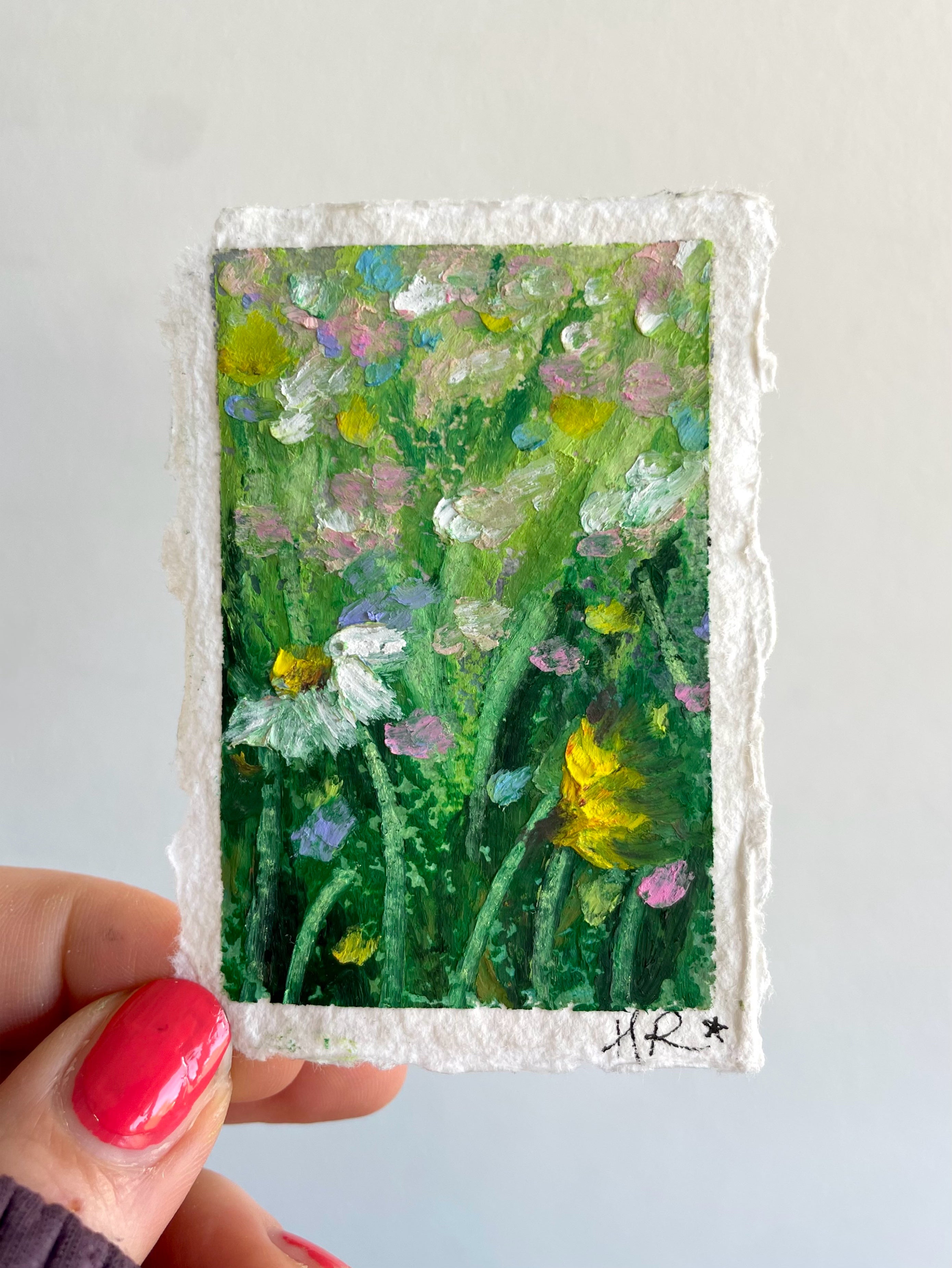 Mini original oil pastel floral painting featuring lush greenery, colourful flowers, and layered impressionist texture inspired by magical nature scenes.