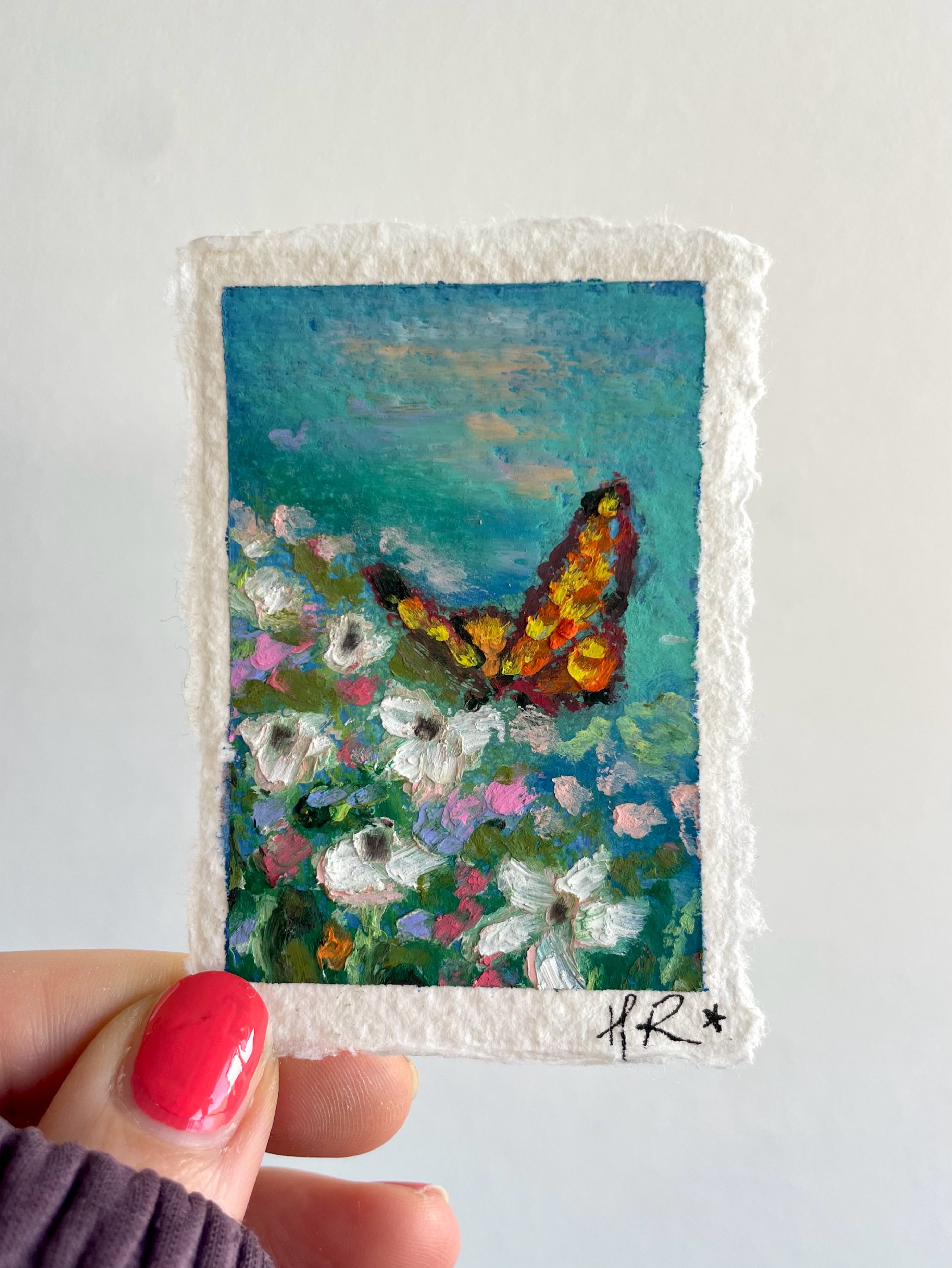Mini original oil pastel painting featuring striking orange butterfly, colourful flowers, and vibrant blue pond with rich layered texture and magical atmosphere.