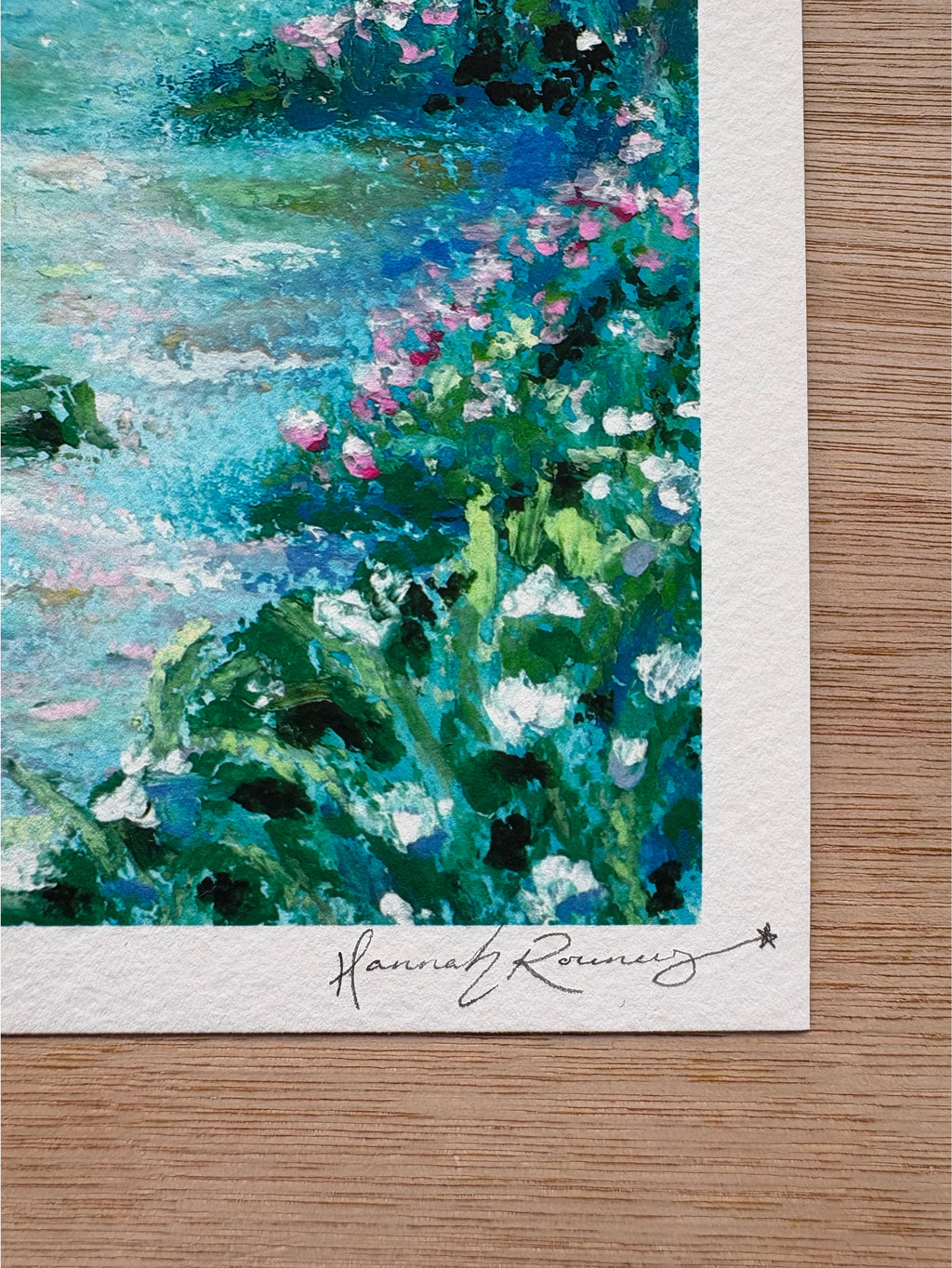 Close-up detail of mystical forest giclée print showing textured wildflowers and hand-signed pencil signature in rich blue-toned landscape.