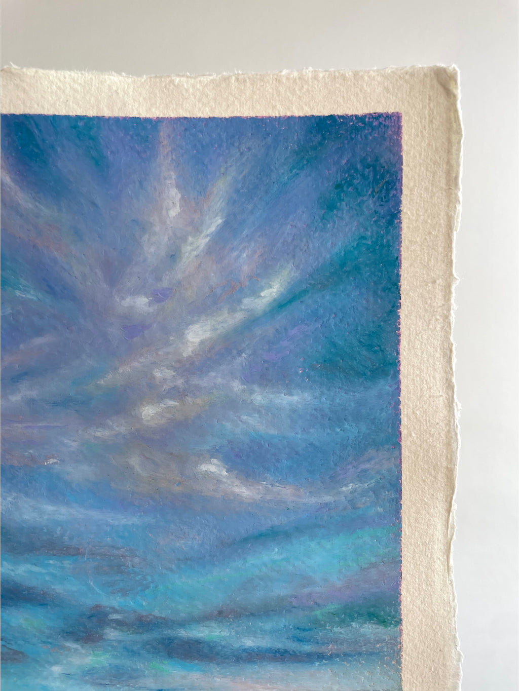 Close-up detail of dramatic blue and purple sky with soft clouds above a whimsical oil pastel wildflower meadow landscape.